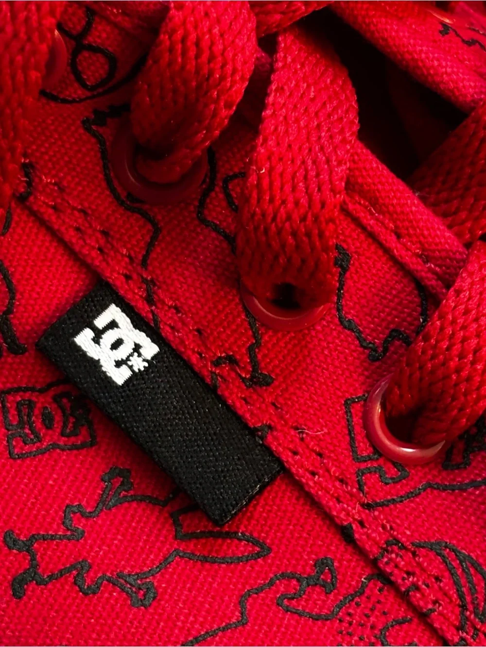 DC Red Sneakers with Black Playful Print men’s 8 women 9.5 low top fun style